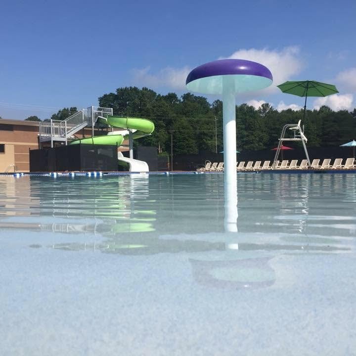 A mushroom water feature in the shallow splash area at the Aquatic Center